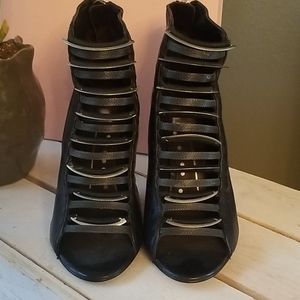 Dolce Vita black open toed booties.